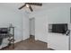 Bedroom featuring wood-look floors, closet, and ceiling fan at 12937 Trade Port Pl, Riverview, FL 33579