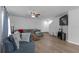 Cozy living space features wood flooring, neutral walls, and a comfortable seating area at 12937 Trade Port Pl, Riverview, FL 33579