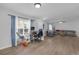 Bright and airy living space featuring laminate floors, ample seating, and lots of natural light at 12937 Trade Port Pl, Riverview, FL 33579