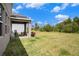 Large backyard with a covered patio perfect for relaxing and enjoying the outdoors at 13802 Kinsale St, Riverview, FL 33579