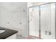 Modern bathroom featuring a glass-enclosed shower and neutral-toned walls at 13802 Kinsale St, Riverview, FL 33579