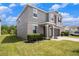 Exterior view of a two-story home with a green lawn, two-car garage, and welcoming front porch at 13802 Kinsale St, Riverview, FL 33579