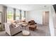 Bright living room with ample seating and decorative curtains at 13802 Kinsale St, Riverview, FL 33579