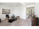 Cozy living room featuring neutral carpet, ample natural light, and contemporary decor with a spacious layout at 13802 Kinsale St, Riverview, FL 33579