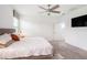 Main bedroom features ceiling fan, neutral walls, and plush carpet at 13802 Kinsale St, Riverview, FL 33579