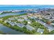 Beautiful aerial view of waterfront condos with lush landscaping, and Gulf of Mexico in the background at 14649 Seminole Trl # 5, Seminole, FL 33776
