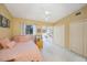 Bedroom featuring a ceiling fan, neutral carpet, and natural light at 14649 Seminole Trl # 5, Seminole, FL 33776