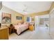 Bedroom with desk space, neutral carpet, and ceiling fan at 14649 Seminole Trl # 5, Seminole, FL 33776