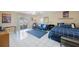Relaxing living area with tile floors, ceiling fan, and access to a screened patio with a view at 14649 Seminole Trl # 5, Seminole, FL 33776