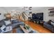 Spacious living room with hardwood floors, comfortable seating, and seamless flow into the dining area at 14649 Seminole Trl # 5, Seminole, FL 33776