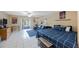 Inviting living space with tile floors, natural light, leading to screened patio, and casual furnishings at 14649 Seminole Trl # 5, Seminole, FL 33776