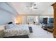 Spacious main bedroom featuring a large bed, ample natural light, and a mirrored wall at 14649 Seminole Trl # 5, Seminole, FL 33776