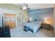 Cozy bedroom with neutral paint, carpet, ceiling fan, and natural light at 14649 Seminole Trl # 5, Seminole, FL 33776
