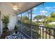 Cozy screened patio with ceiling fan and a view of the landscaped backyard at 14649 Seminole Trl # 5, Seminole, FL 33776