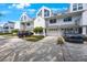 Clean townhome with attached garages and driveway parking, manicured landscaping, and well maintained facade at 14649 Seminole Trl # 5, Seminole, FL 33776