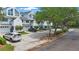 A street view of townhomes with well-manicured lawns, garages, and plentiful parking at 14649 Seminole Trl # 5, Seminole, FL 33776