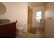 Bathroom featuring a glass vessel sink, granite vanity, and a shower with stylish tiling at 1670 Palmwood Dr, Clearwater, FL 33756