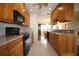 Beautifully updated kitchen featuring granite countertops, stainless steel appliances, and wood cabinets at 1670 Palmwood Dr, Clearwater, FL 33756
