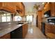 Updated kitchen with sleek black appliances, tile floors, and a breakfast bar for casual dining and entertaining at 1670 Palmwood Dr, Clearwater, FL 33756