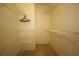 Spacious walk-in closet with multiple shelves and hanging rods for ample storage at 1670 Palmwood Dr, Clearwater, FL 33756