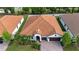 Aerial view of a single-story home showcasing its well-maintained yard and neighborhood at 16913 Clear Cork Dr, Wimauma, FL 33598