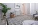Light-filled bedroom with console table and stylish decor at 16913 Clear Cork Dr, Wimauma, FL 33598