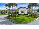 The clubhouse boasts a grand entrance with lush landscaping and manicured lawns at 16913 Clear Cork Dr, Wimauma, FL 33598