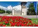 Community entrance sign 'Southshore Bay' with a vibrant flower bed and manicured lawn at 16913 Clear Cork Dr, Wimauma, FL 33598