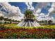 Stunning community fountain surrounded by vibrant flowers and lush landscaping at 16913 Clear Cork Dr, Wimauma, FL 33598