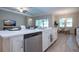 Kitchen with stone countertops, stainless steel appliances, and an open-concept layout to the living and dining areas at 16913 Clear Cork Dr, Wimauma, FL 33598