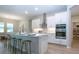 Bright kitchen showcasing white cabinetry, stainless steel appliances, and a breakfast bar with stool seating at 16913 Clear Cork Dr, Wimauma, FL 33598