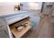 Kitchen cabinet with pull-out shelving for organized storage of pots and pans at 16913 Clear Cork Dr, Wimauma, FL 33598