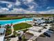 Aerial view of a lagoon and community park at 16913 Clear Cork Dr, Wimauma, FL 33598