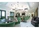 Spacious lounge area with modern lighting, comfortable seating, and stylish décor for relaxing at 16913 Clear Cork Dr, Wimauma, FL 33598