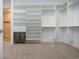 Spacious walk-in closet with custom shelving and plenty of room for storage and organization at 16913 Clear Cork Dr, Wimauma, FL 33598