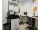 Office with workspace featuring a modern desk, printer, computer, and comfortable chairs at 16913 Clear Cork Dr, Wimauma, FL 33598