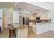 Spacious kitchen with a breakfast bar, stainless steel appliances, and ample cabinet space for convenience and style at 1793 Pipers Meadow Dr, Palm Harbor, FL 34683
