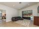 Comfortable living room with a slider to the outdoor space, light wood floors, and neutral walls at 1793 Pipers Meadow Dr, Palm Harbor, FL 34683