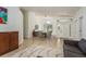 Open-concept living space features neutral décor, dining area, and a large window for natural light at 1793 Pipers Meadow Dr, Palm Harbor, FL 34683