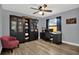 Bedroom with beautiful wood floors and a ceiling fan offers lots of natural light at 1807 Tawnee Pl, Brandon, FL 33510
