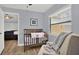 Bedroom featuring a wooden crib, chair, and wood-look flooring at 1807 Tawnee Pl, Brandon, FL 33510