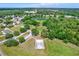 Aerial view of a community park featuring a basketball court and picturesque walking trails and playground at 1807 Tawnee Pl, Brandon, FL 33510