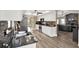 A galley kitchen features granite countertops and stainless steel appliances with an eat-in kitchen at 1807 Tawnee Pl, Brandon, FL 33510