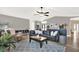 Bright living room with comfortable leather sofa, stylish decor, and modern ceiling fan at 1807 Tawnee Pl, Brandon, FL 33510