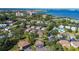 An aerial view of the community homes with mature trees, some water views, and a pool in the community at 1836 Bough Ave # C, Clearwater, FL 33760