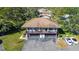 Aerial view of a two-story home featuring a private balcony and a well-kept driveway with ample parking at 1836 Bough Ave # C, Clearwater, FL 33760