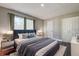 Comfortable bedroom showcasing a stylish bed with a plush headboard, soft bedding, and modern nightstands at 1836 Bough Ave # C, Clearwater, FL 33760
