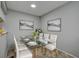 Dining room with contemporary decor with seating for six around a glass table at 1836 Bough Ave # C, Clearwater, FL 33760