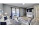 Bright and airy living room with comfortable seating, modern decor, and plenty of natural light at 1836 Bough Ave # C, Clearwater, FL 33760