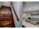 Interior staircase leading to a living space featuring a cozy couch and a stylish area rug at 1836 Bough Ave # C, Clearwater, FL 33760